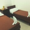 Отель Davao Hub Dormitel Bed & Breakfast - Hostel в Давао