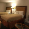 Отель Travelers Inn & Suites, фото 3