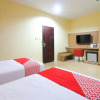 Отель OYO 1153 Tiga Dara Hotel & Resort Syariah, фото 24
