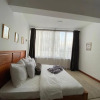 Отель Karim house, 2 bedroom apartment with king beds, balcony view and workspace in Kilimani Nairobi, фото 4