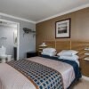Отель Boardwalk Hotel Charlee & Beach House Rentals в Сисайд-Хайтсе