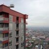 Отель Cozy And High Floor Studio Room At Vida View Makassar Apartment, фото 1