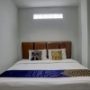 Отель SPOT ON 92822 Finest House Near Amplas Bus Terminal, фото 8