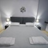 Отель A&J Apartments or Rooms athens airport в Макропулу-Месогее