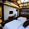 Отель Lijiang Yiran Ethnic custom Viewing Inn, фото 5