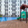 Отель Comfortable And Modern 1Br Without Living Room At Amartha View Apartment, фото 9