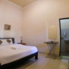 Отель OYO 1190 Ndalem Katong Guest House, фото 26