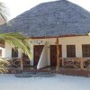 Отель Mbuyuni Beach Village - Bungalows на пляже Jambiani