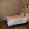 Отель Guest Inn & Suites, фото 4