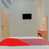 Отель OYO 90804 Oma Uti Homestay Syariah, фото 27