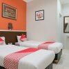 Отель OYO 589 Hotel Desa Puri Syariah, фото 4