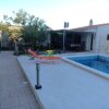 Отель Apartment With one Bedroom in Kaštel Novi, With Shared Pool, Enclosed Garden and Wifi в Каштеле