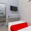 Отель OYO Life 92691 Mc Kost Syariah, фото 7