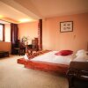 Отель Lijiang Xunniuge Guest House, фото 7