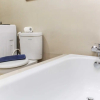 Отель Nice And Comfort Studio Room At Azalea Suites Apartment, фото 8