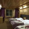 Отель Jiuzhaigou Xin Tao Ge Tibetan Inn, фото 7