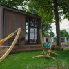 Отель Cozy tiny house on the water, located in a holiday park in the Betuwe, фото 13