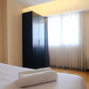 Отель Homey 2Br At Braga City Walk Apartment, фото 4