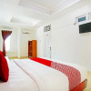 Отель Oyo 91460 Guest House Kencana Syariah, фото 4