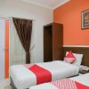 Отель OYO 589 Hotel Desa Puri Syariah, фото 12