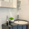 Отель Homey And Clean Studio At Sky House Alam Sutera Apartment, фото 7
