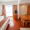 Отель Qingdao Dusco Holiday Apartment, фото 12