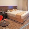 Отель Golden Tulip Suites - Dubai, фото 16