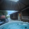Отель Woodpecker Log Cabin with hot tub, pizza oven bbq entertainment area, lakeside with private fishing , фото 35