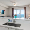 Отель Sandy Feet Retreat Ocean View Condo, фото 6