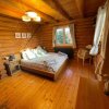 Отель Woodpecker Log Cabin with hot tub, pizza oven bbq entertainment area, lakeside with private fishing , фото 12