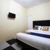 Отель Tiga Mas Inn by OYO Rooms, фото 17
