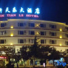 Отель Xin Tian Le Hotel, фото 1