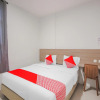 Отель OYO 90306 Mmtc2 Guest House, фото 10