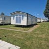 Отель Luxury Static Caravan Sleeps 6 Coopers Beach, фото 1