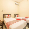 Отель OYO 936 Tremigo Guest House Syariah, фото 4