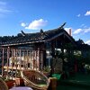 Отель 21C Lijiang Scenery Guesthouse, фото 1