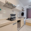 Отель Warm And Comfortable Studio Room At Sky House Bsd Apartment, фото 1