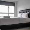 Отель Minimalist and Comfy 1BR Apartment Scientia Residence, фото 10