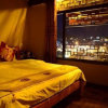 Отель Lijiang Lion Mountain Inn в Лицзяне