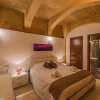 Отель Valletta Merisi Suites, фото 3