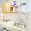 Отель Cozy And Spacious Studio Room At Mekarwangi Square Apartment, фото 13
