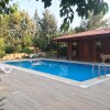 Отель Lovely Summer House With Shared Pool in Kepez, фото 6