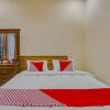 Отель OYO 90506 Bunga Sonsang Homestay Syariah, фото 7