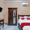 Отель OYO 92223 Alfatar Homestay Syariah, фото 12