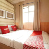 Отель OYO 93746 The Metro Suites Apartment By Yusuf, фото 2