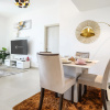 Отель Elite LUX Holiday Homes - Modern 1BR Resort Amenities in Production City, фото 4