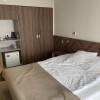 https://cdn.worldota.net/t/{size}/hotel_review/26/eb/26ebb99b23057d98061acf48b3ffe67fa283f54a.JPEG