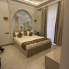 https://cdn.worldota.net/t/100x100/hotel_review/53/be/53bec7a5ac06cd6fce4f8fa285201d34b476ea24.JPEG
