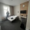 https://cdn.worldota.net/t/{size}/hotel_review/84/49/8449e5bfbadc1e47c39aba4ff499b1b08793834b.JPEG
