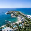 Отель Grand Resort Lagonissi в Сарониках